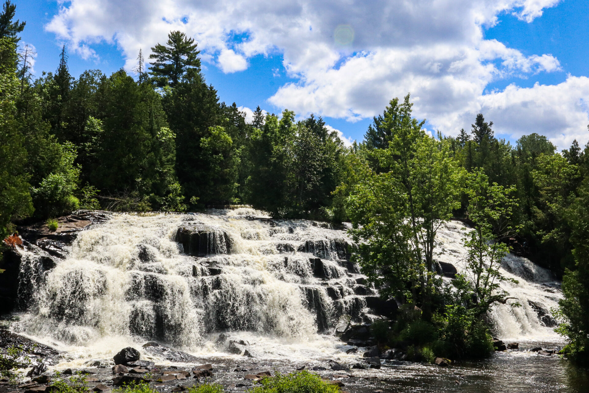 Tahquamenon Falls wide cascade showing amber-colored water