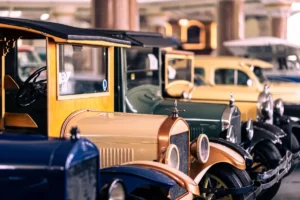 Explore classic and antique cars lined up in an indoor vintage car museum exhibit