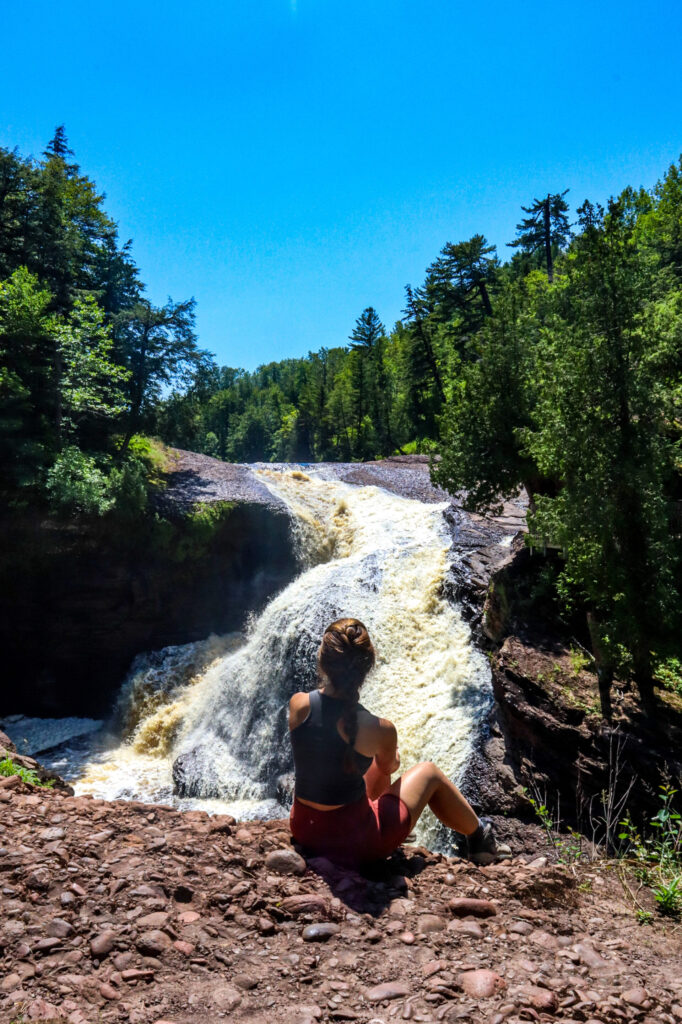 Rainbow Falls surrounded by fall foliage in Michigan Upper Peninsula