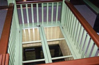 Window in floor of Winchester Mystery House allowing view to kitchen below