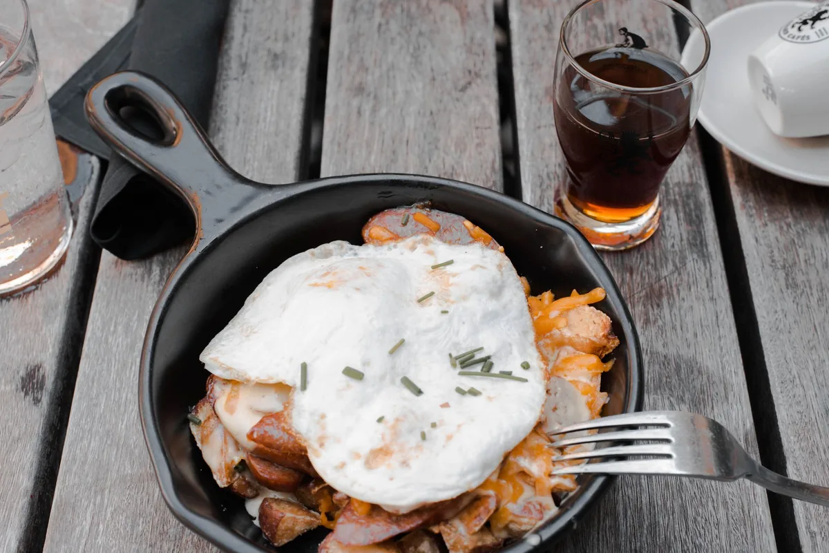 Close-up of a delicious rustic breakfast with fried eggs in a skillet